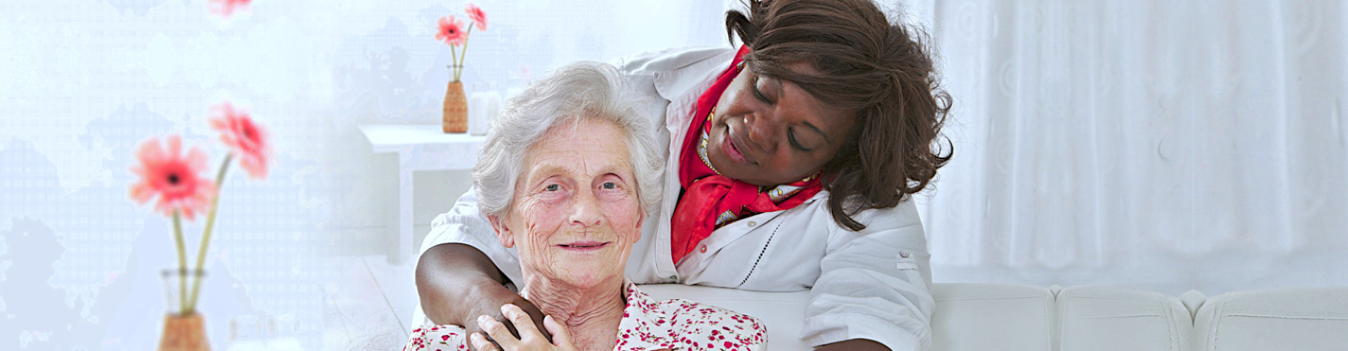 caregiver and eldery woman smiling